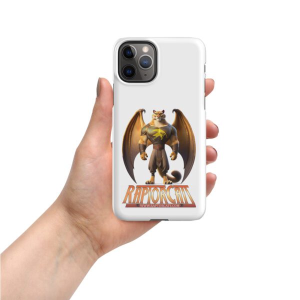 A hand holding an iphone case with a dragon on it.