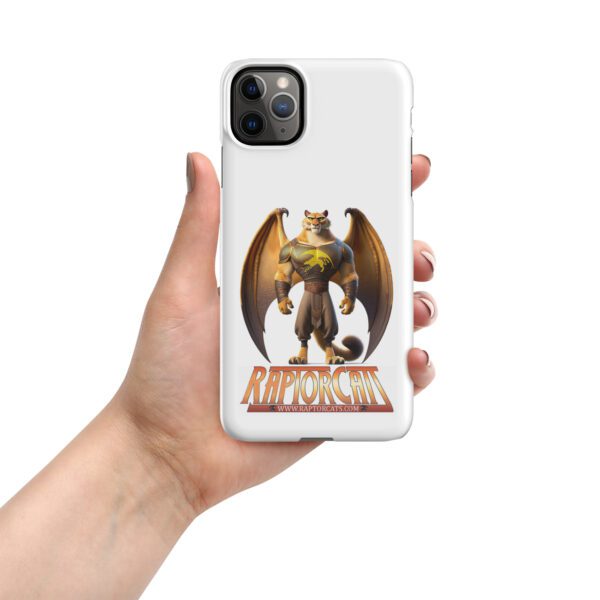 A hand holding an iphone case with a dragon on it.