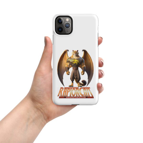 A hand holding an iphone case with a dragon on it.