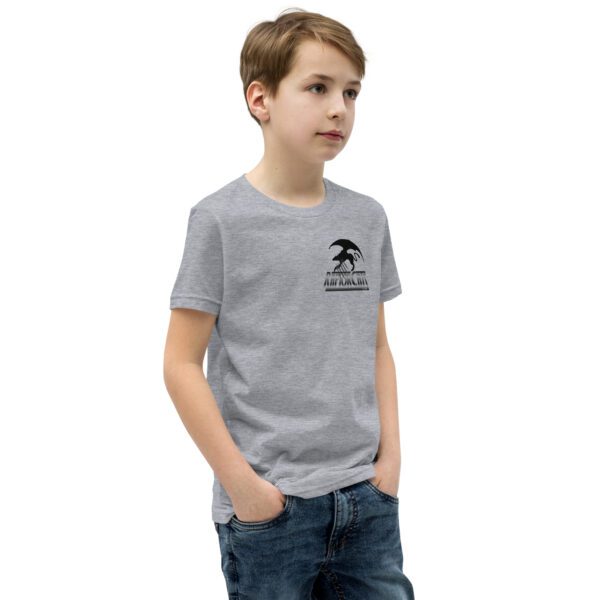 A boy wearing jeans and a t-shirt