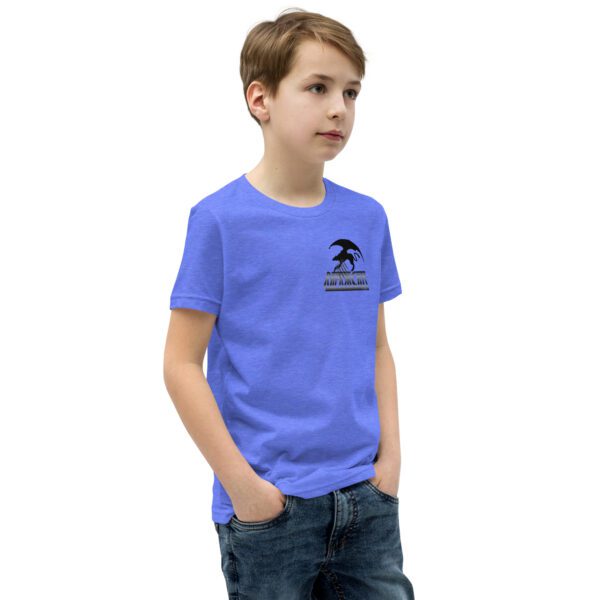 A boy wearing jeans and a t-shirt