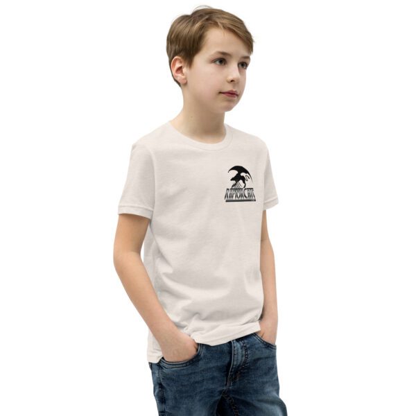 A boy wearing jeans and a t-shirt