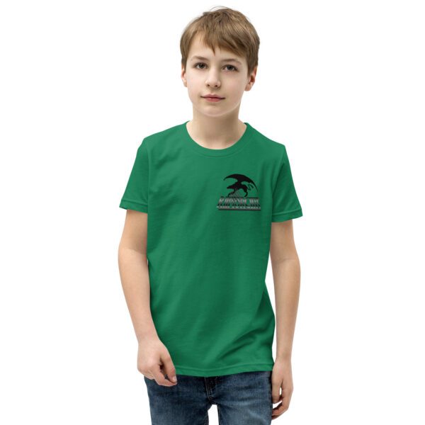 A young boy wearing a green shirt and jeans.