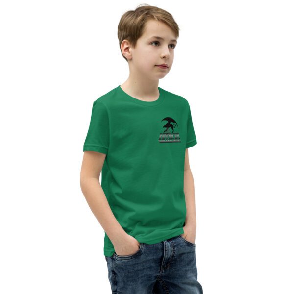 A boy wearing a green shirt and jeans.