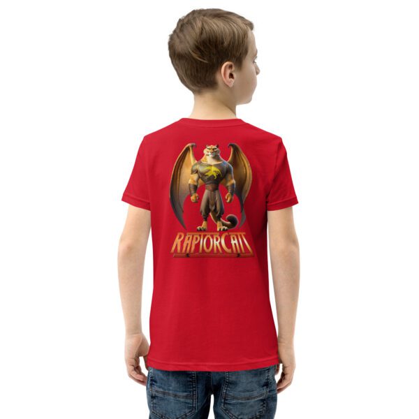 A boy wearing a red shirt with an image of a dragon on it.