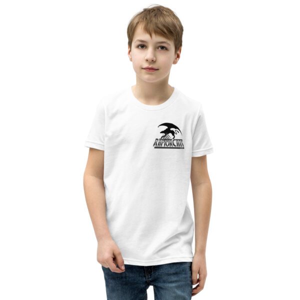 A boy wearing white t-shirt with black logo.