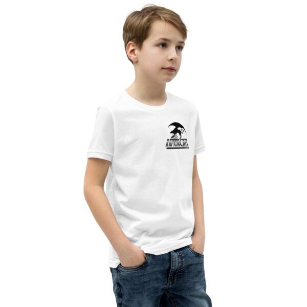 A boy wearing a white t-shirt with a black logo.