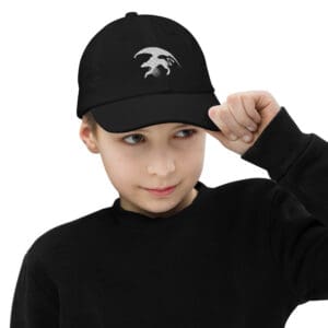 Child wearing black cap with white logo.