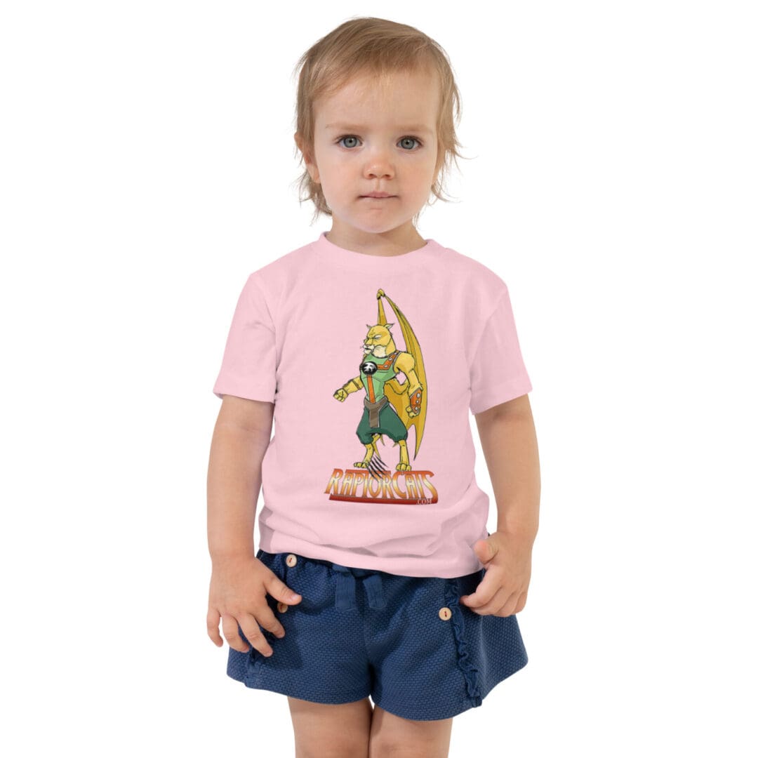 Toddler wearing pink superhero print shirt.